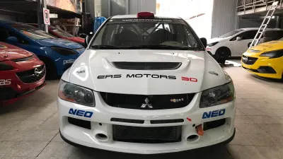 Champion Behind the Wheel of an EVO IX